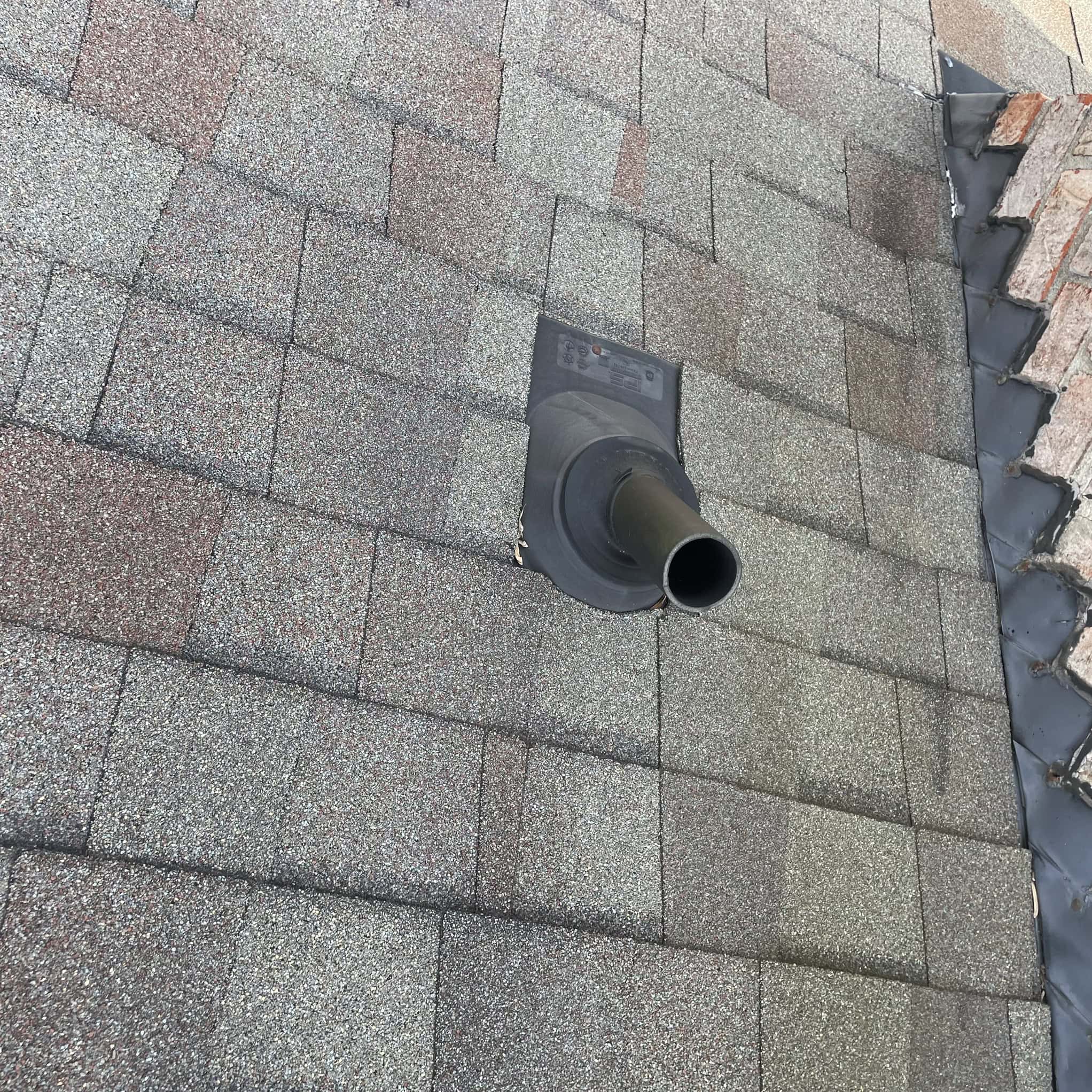 Storm-damaged roof in Greensboro after severe weather